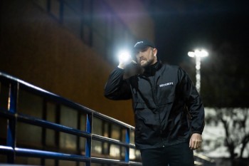 security guard walking building perimeter